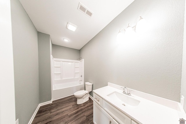 full bathroom featuring wood-type flooring, toilet, shower / bathing tub combination, and vanity