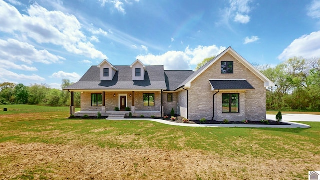 view of front facade with a porch and a front lawn