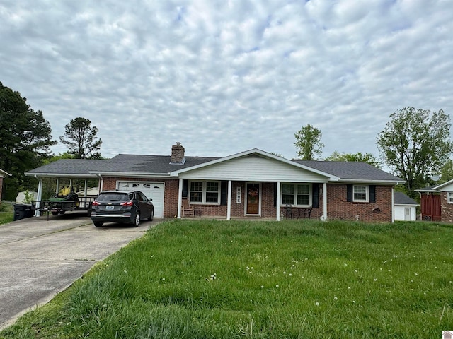 view of front of property with a carport, a garage, and a front lawn