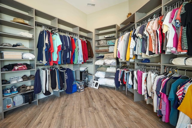 spacious closet featuring hardwood / wood-style flooring