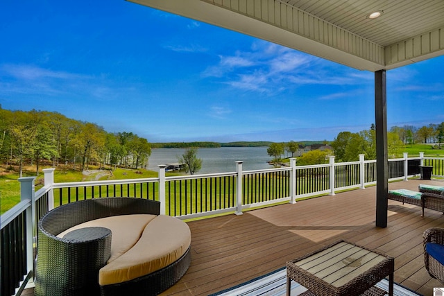 deck featuring a yard and a water view