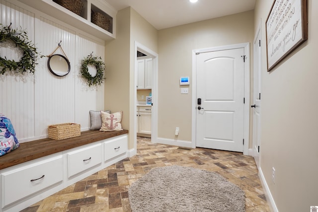 mudroom with light tile floors