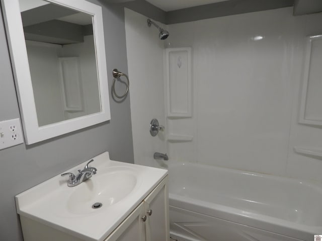 bathroom with bathtub / shower combination and vanity