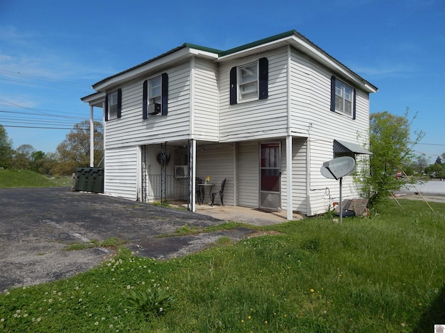 back of house with a yard