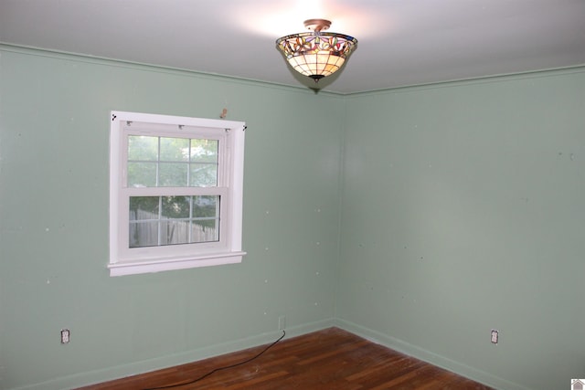 empty room featuring dark wood-type flooring