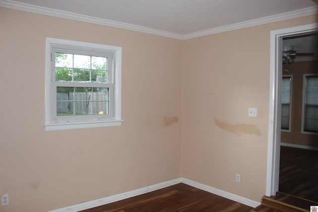 unfurnished room featuring crown molding and dark hardwood / wood-style floors