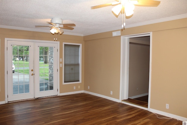 unfurnished room with a textured ceiling, dark hardwood / wood-style flooring, and french doors