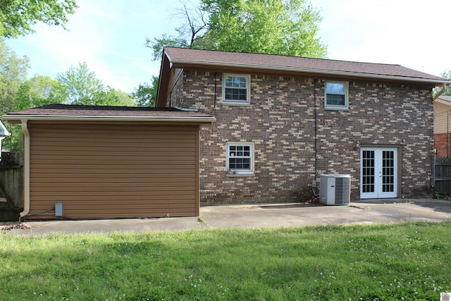 back of house featuring french doors, a yard, a patio area, and cooling unit