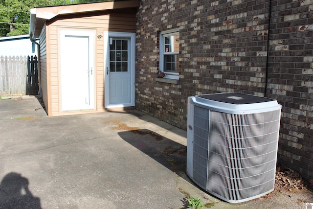 exterior space with central AC and a patio area