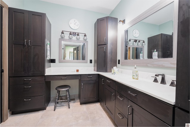 bathroom with vanity and tile flooring