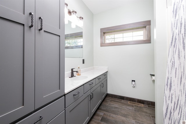 bathroom featuring tile floors and vanity