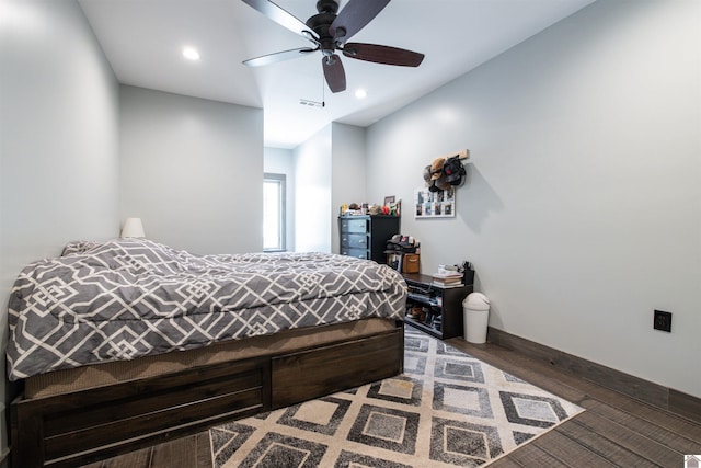 bedroom featuring dark hardwood / wood-style flooring and ceiling fan