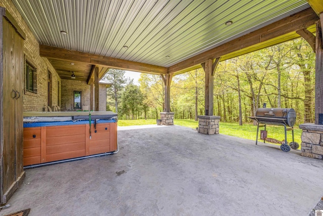 view of patio with a hot tub and grilling area