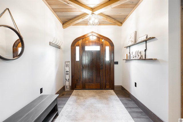 foyer with dark hardwood / wood-style floors, beam ceiling, and coffered ceiling