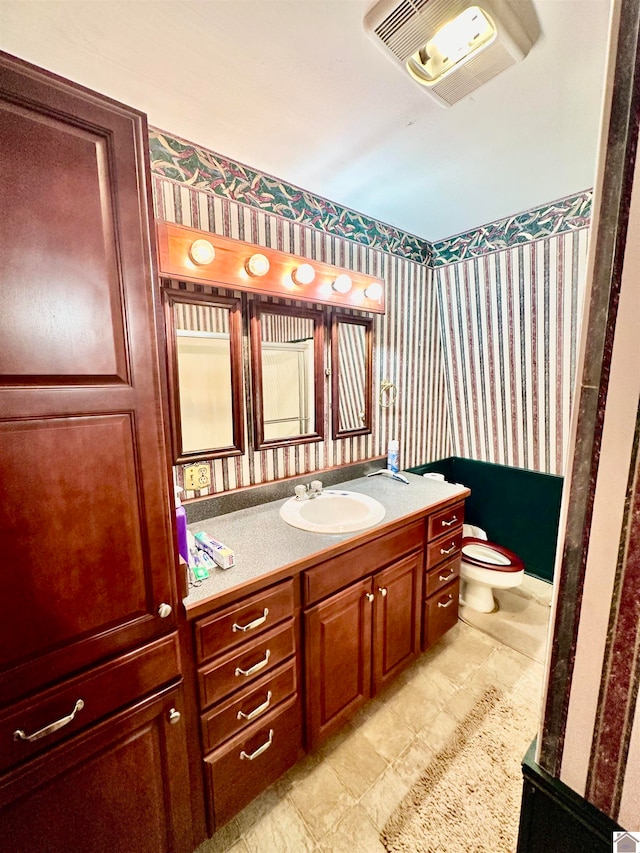 bathroom with vanity and toilet