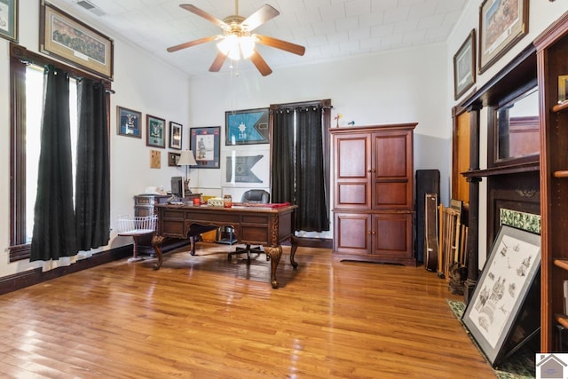 office area featuring light hardwood / wood-style flooring and ceiling fan