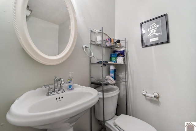 bathroom with sink and toilet