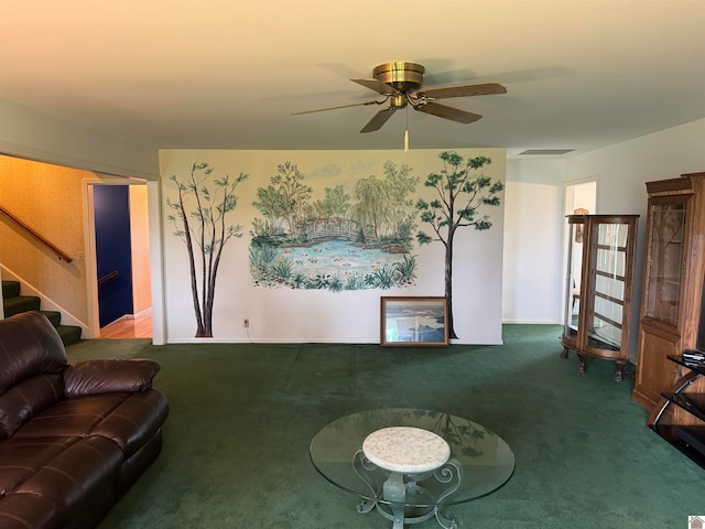 living room with ceiling fan and carpet