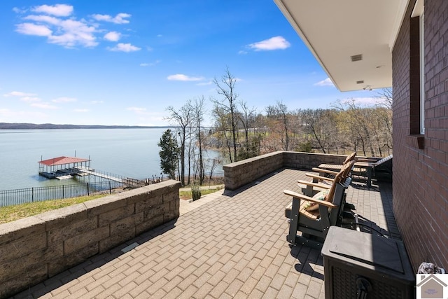 view of patio / terrace featuring a water view