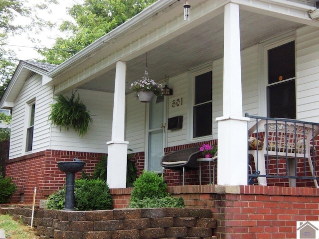 property entrance featuring covered porch