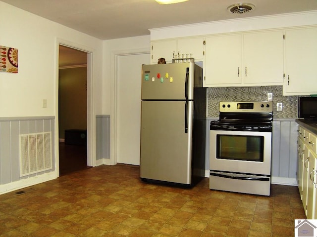 kitchen with white cabinetry, stainless steel refrigerator, electric range, and decorative backsplash