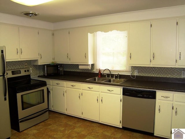 kitchen with decorative backsplash, stainless steel appliances, white cabinets, and sink