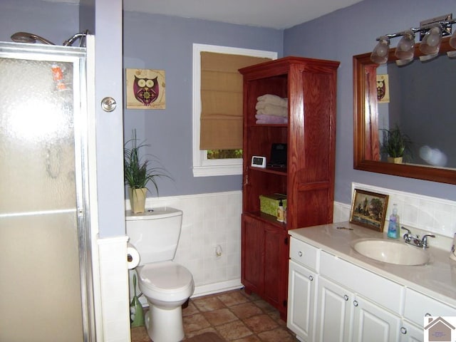 bathroom featuring tile flooring, large vanity, and toilet