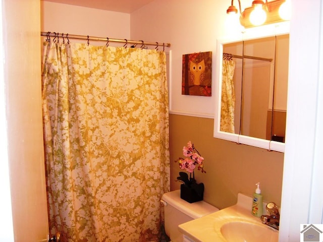 bathroom with vanity and toilet