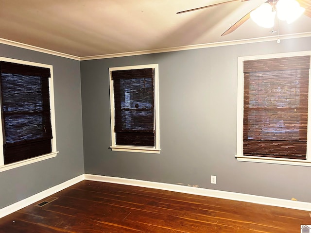 unfurnished room with dark hardwood / wood-style flooring, ceiling fan, and ornamental molding