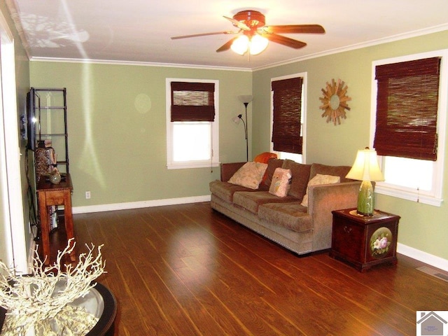 living room with crown molding, dark hardwood / wood-style flooring, and ceiling fan