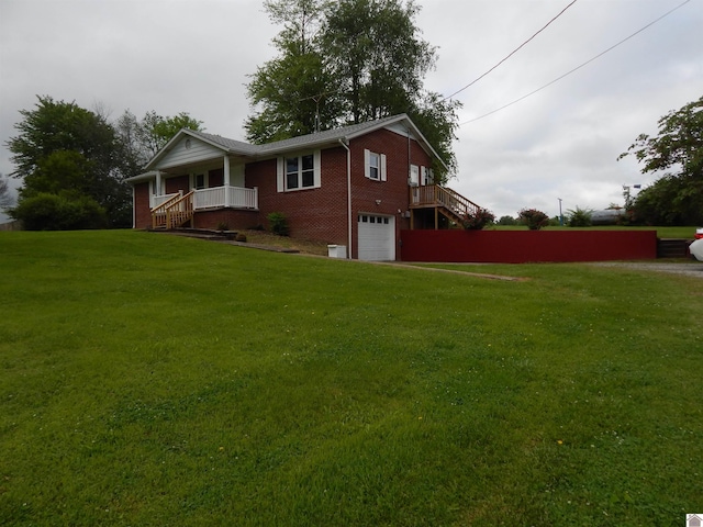 view of front of home featuring a garage and a front lawn