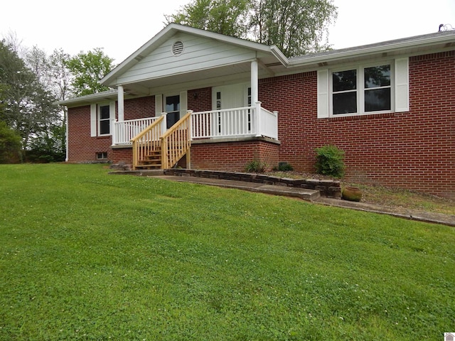 view of front of property with a front lawn and covered porch