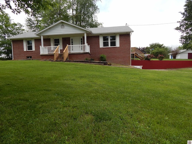 view of front of house featuring a front lawn and covered porch