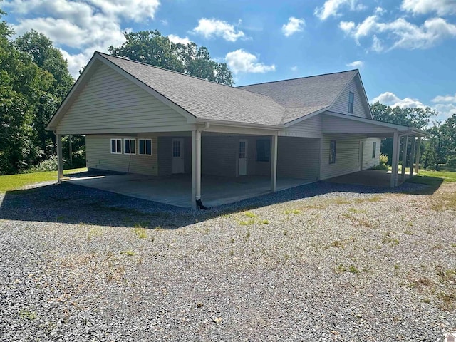 view of side of home featuring a carport