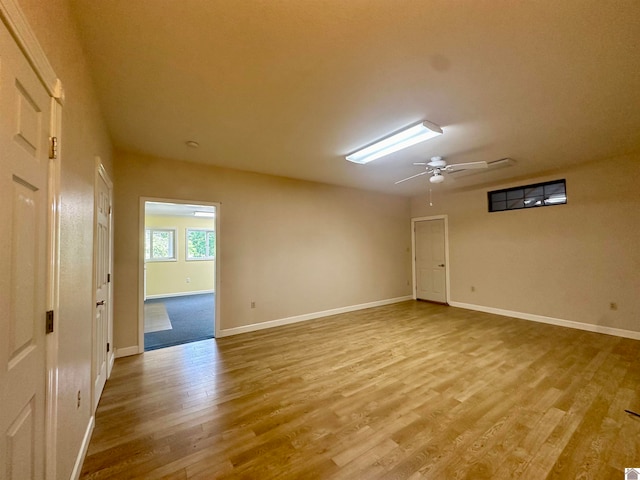 spare room featuring wood-type flooring and ceiling fan