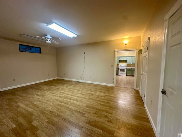 spare room featuring wood-type flooring and ceiling fan