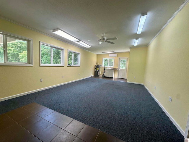 carpeted empty room featuring a wall mounted AC, ornamental molding, and ceiling fan