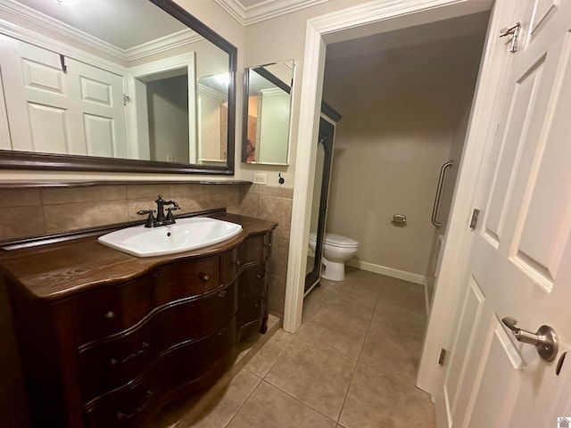 bathroom with tile flooring, ornamental molding, backsplash, vanity, and toilet