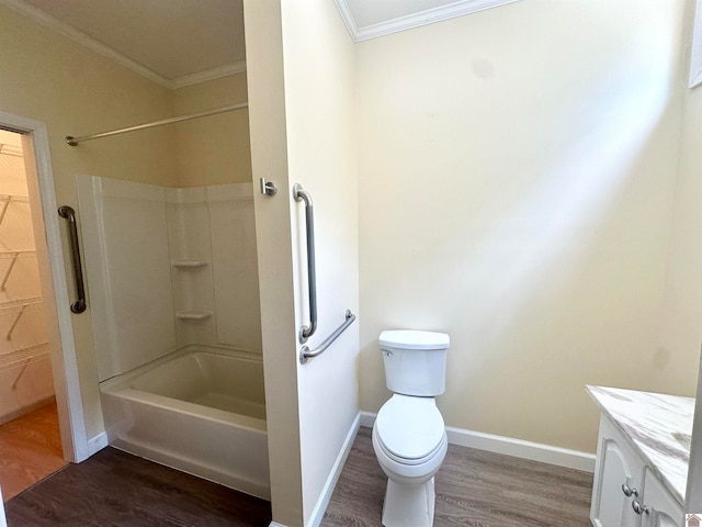 full bathroom with crown molding, washtub / shower combination, wood-type flooring, vanity, and toilet