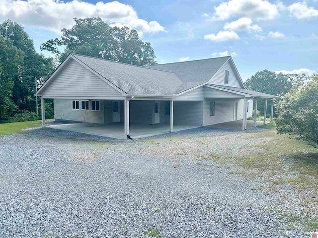 view of side of home featuring a carport