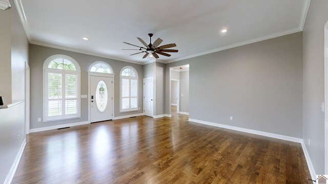 entryway with dark hardwood / wood-style floors, ceiling fan, and ornamental molding