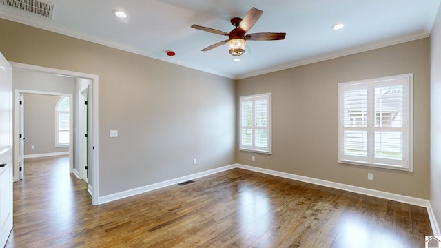 spare room featuring ornamental molding, ceiling fan, and dark hardwood / wood-style flooring