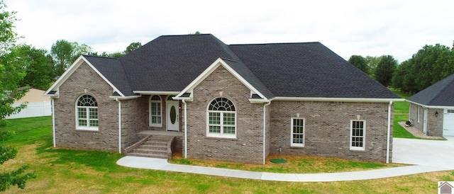 view of front facade with a garage and a front lawn