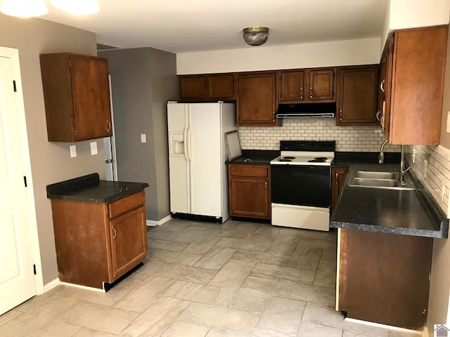 kitchen featuring backsplash, white appliances, light tile flooring, and range hood