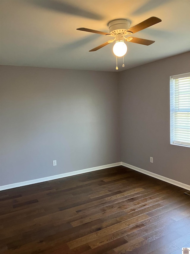 empty room featuring dark hardwood / wood-style floors and ceiling fan