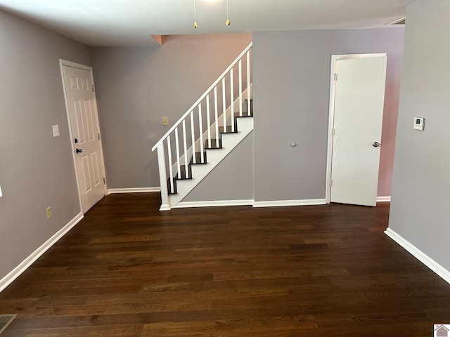 foyer featuring dark wood-type flooring