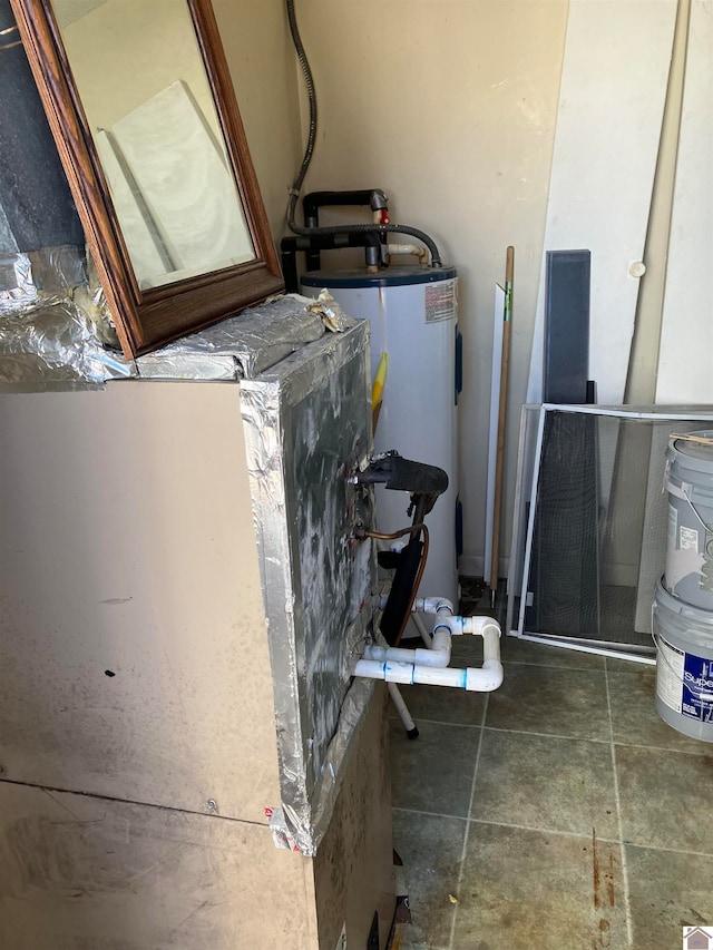 utility room featuring electric water heater