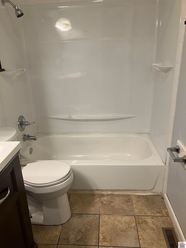 full bathroom featuring bathtub / shower combination, vanity, toilet, and tile floors