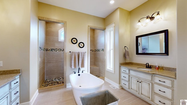 bathroom featuring vanity, tile patterned floors, and independent shower and bath