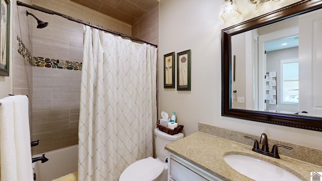 full bathroom with shower / tub combo with curtain, vanity, and toilet